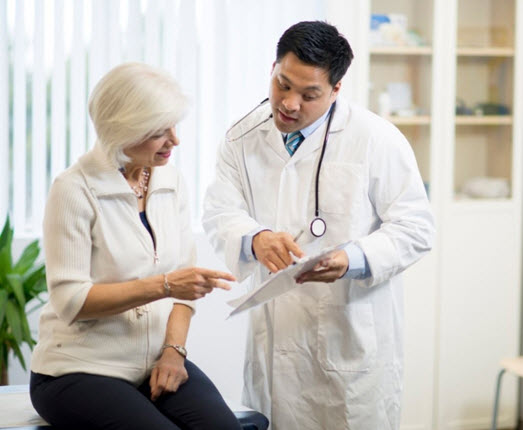 doctor helping senior patient 