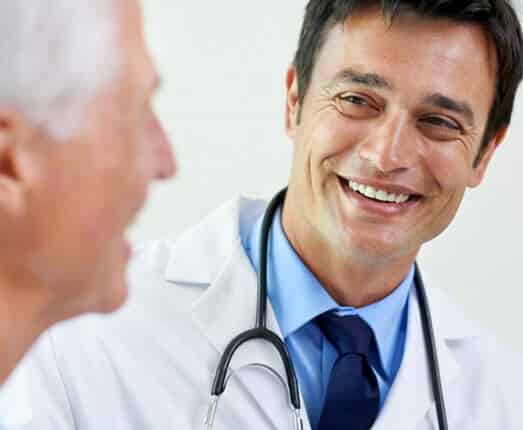 doctor smiling at senior patient