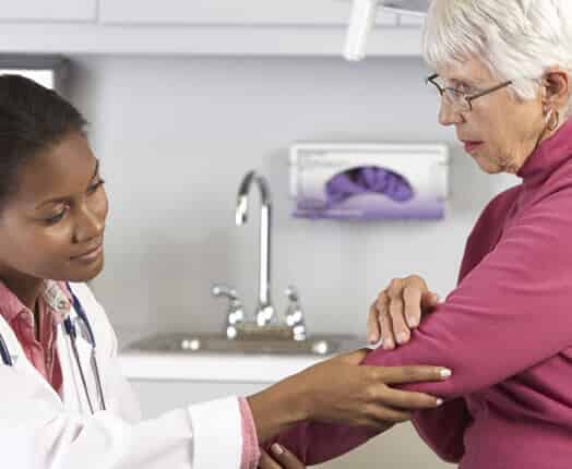 doctor helping patient